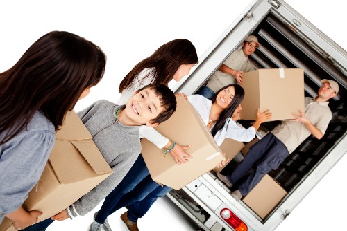 Removal team planning a house move in a Fulham street