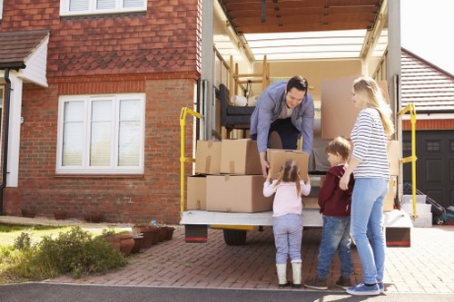 Unpacking boxes in a Fulham flat after relocation