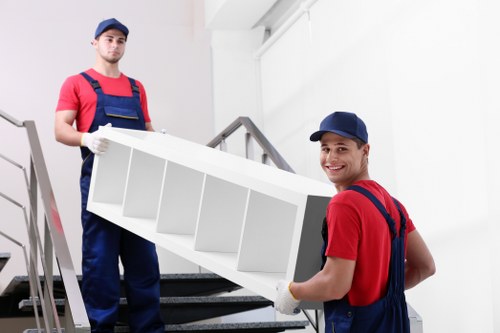 Removal van and moving team in a Fulham residential street