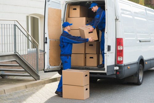 Furniture and boxes being moved from a Fulham flat with narrow stairs