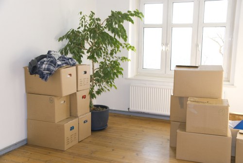 Professional movers handling belongings in a busy Fulham street