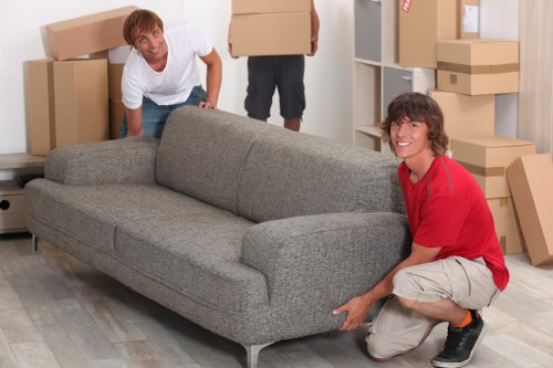 Loading furniture into a van on a Fulham street